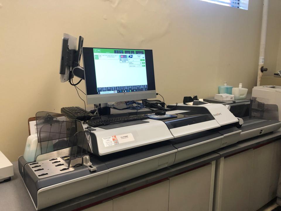 A postage machine sits in the Shelby County mail room, which is used by the Clerk's Office as well as numerous other county divisions.