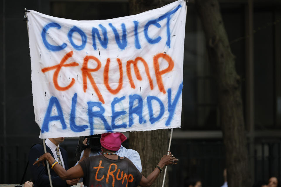 A protestor demonstrates outside Manhattan criminal court ahead of the start of jury selection for former President Donald Trump's criminal trial, Monday, April 15, 2024, in New York. The hush money trial of Trump begins Monday with jury selection. It's a singular moment for American history as the first criminal trial of a former U.S. commander in chief. (AP Photo/Stefan Jeremiah)