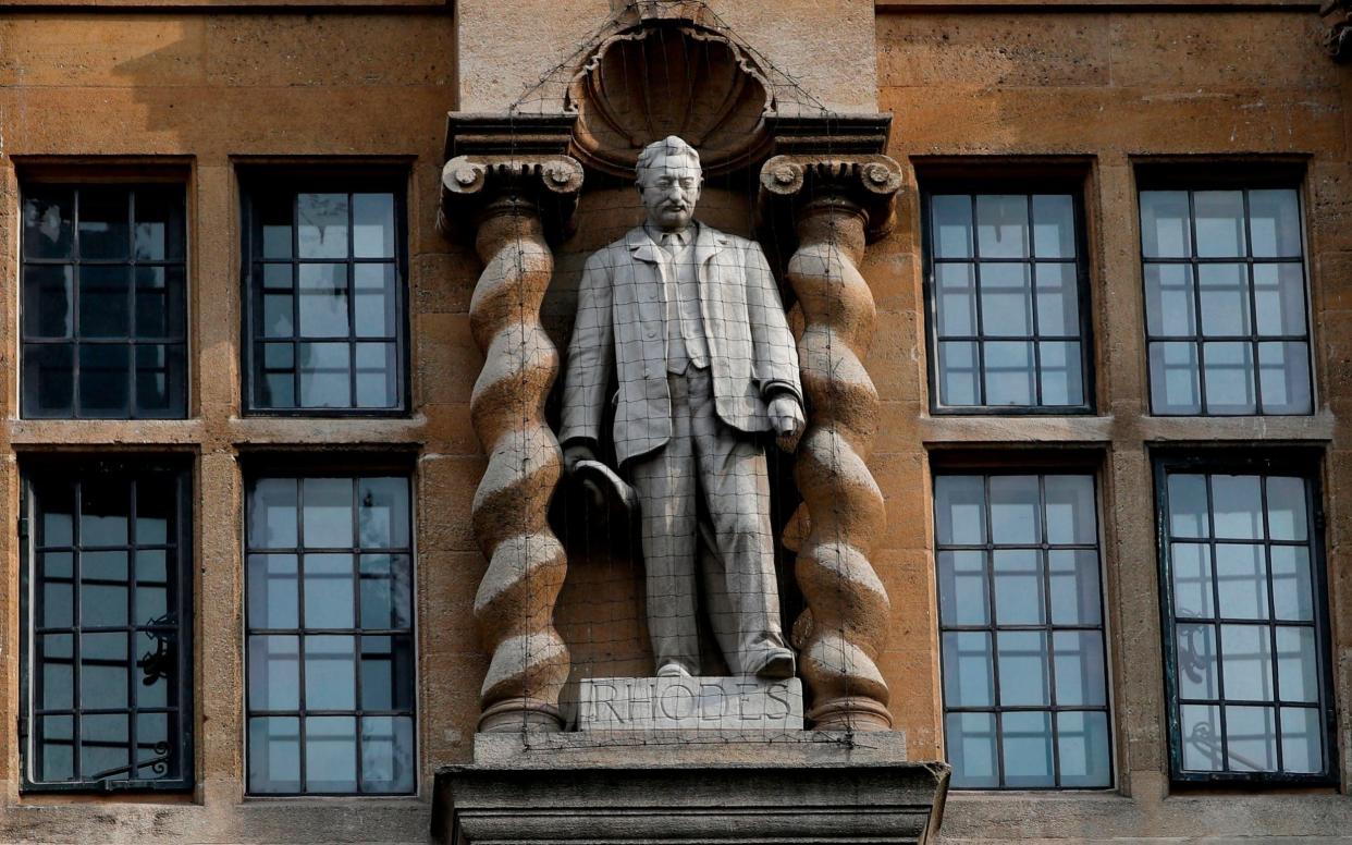 A statue of Cecil John Rhodes outside Oriel College at the University of Oxford - Adrian Dennis/AFP