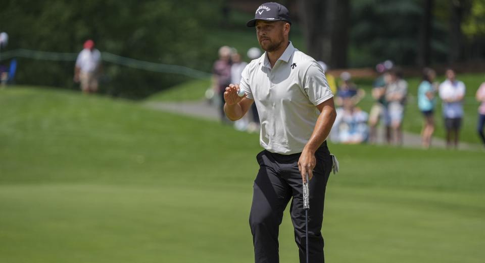 Xander Schauffele acknowledges the gallery on five during the third round of the Wells Fargo Championship golf tournament. (Photo: Jim Dedmon-USA TODAY Sports)