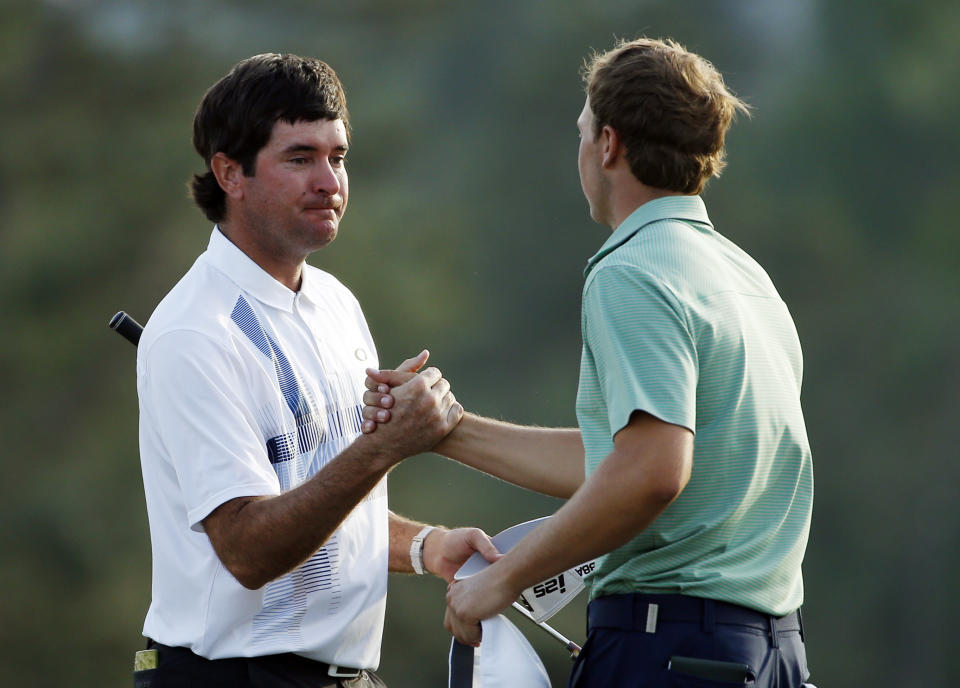 Bubba Watson, left, is congratulated by Jordan Spieth after winning the Masters golf tournament Sunday, April 13, 2014, in Augusta, Ga. (AP Photo/Matt Slocum)