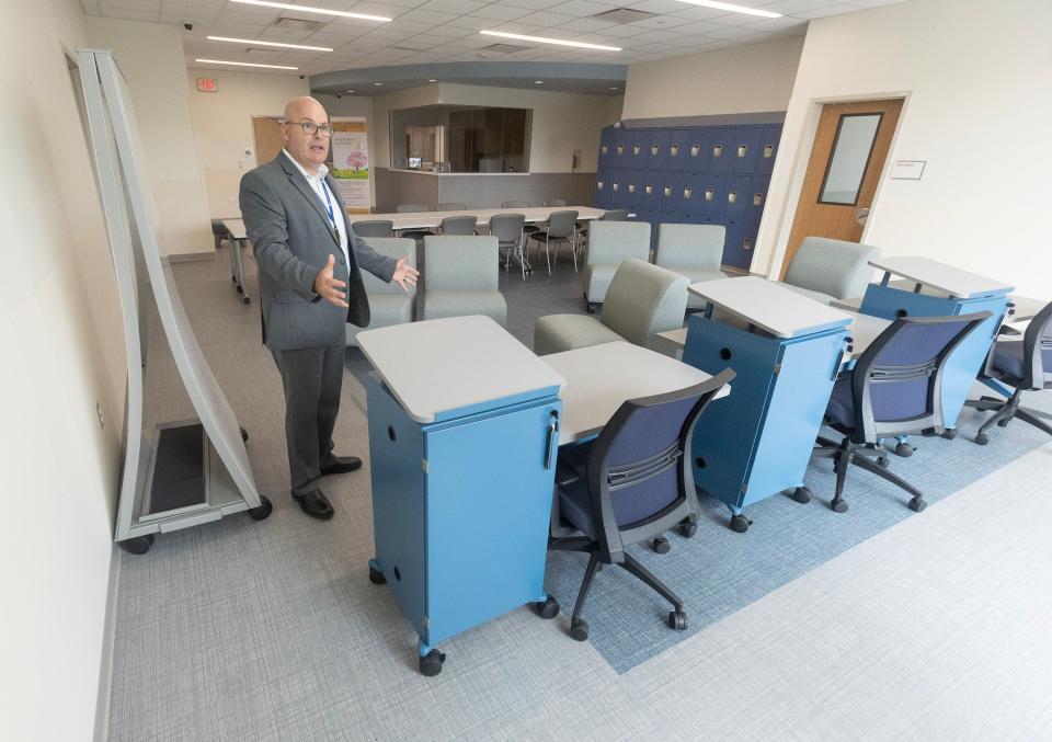 Doug Straight, director of Akron Children's behavioral health service line, discusses the group day room for patients at the new Canton facility.