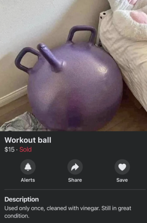 A purple workout ball for sale is pictured beside a bed with a pink toy in a room