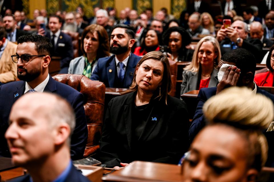 Elissa Slotkin, center, listens as Gov. Gretchen Whitmer delivers her State of the State address on Wednesday, Jan. 24, 2024, at the Michigan State Capitol in Lansing.