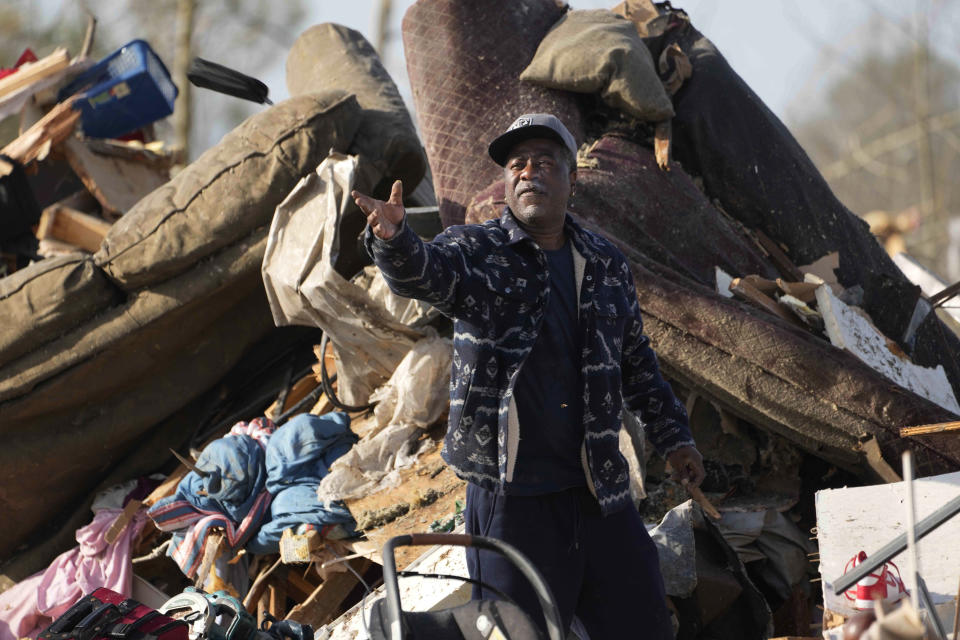 A resident looks through the piles of debris, insulation, and home furnishings to see if anything is salvageable at a mobile home park in Rolling Fork, Miss., Saturday, March 25, 2023. Emergency officials in Mississippi say several people have been killed by tornadoes that tore through the state on Friday night, destroying buildings and knocking out power as severe weather produced hail the size of golf balls moved through several southern states. (AP Photo/Rogelio V. Solis)