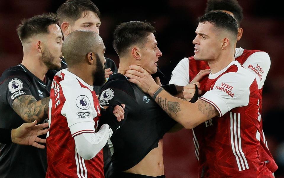Granit Xhaka of Arsenal grabs Ashley Westwood of Burnley around the throat for RED Card - Tom Jenkins