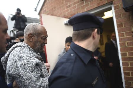 Bill Cosby arrives for his arraignment on sexual assault charges at the Montgomery County Courthouse in Elkins Park, Pennsylvania December 30, 2015. REUTERS/Mark Makela