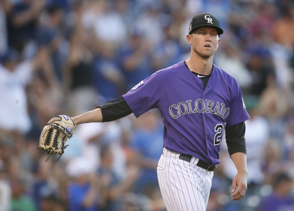 Colorado Rockies starting pitcher Kyle Freeland reacts after giving up a solo home run to Los Angeles Dodgers' Yasiel Puig in the second inning of a baseball game Saturday, Aug. 11, 2018, in Denver. (AP Photo/David Zalubowski)