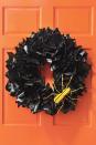 <p>A shiny black wreath fashioned out of spray-painted newspaper is a clever — and easy — way to welcome trick-or-treaters.<br></p><p><strong><a href="https://www.womansday.com/home/crafts-projects/how-to/a5941/craft-project-newspaper-wreath-123858/" rel="nofollow noopener" target="_blank" data-ylk="slk:Get the tutorial;elm:context_link;itc:0;sec:content-canvas" class="link ">Get the tutorial</a>.</strong></p>