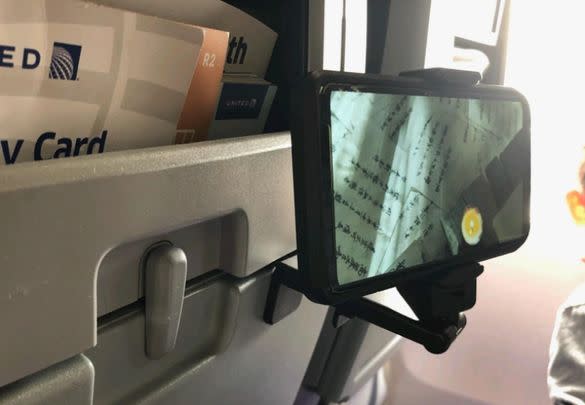 An adjustable and rotating airplane phone mount