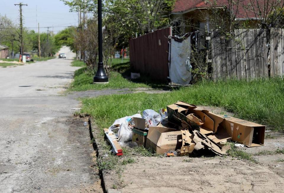 Trash sits on a lot in the Historic Southside neighborhood on April 1, 2021. Residents are frustrated about the amount of illegal dumping in their community.