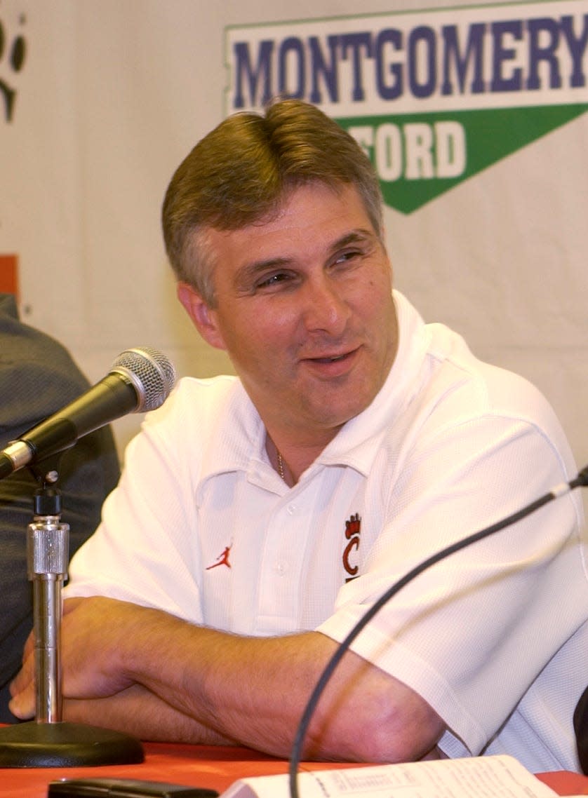Dan Peters answers questions in June of 2004 during a press conference to announce his appointment as interim coach at UC.