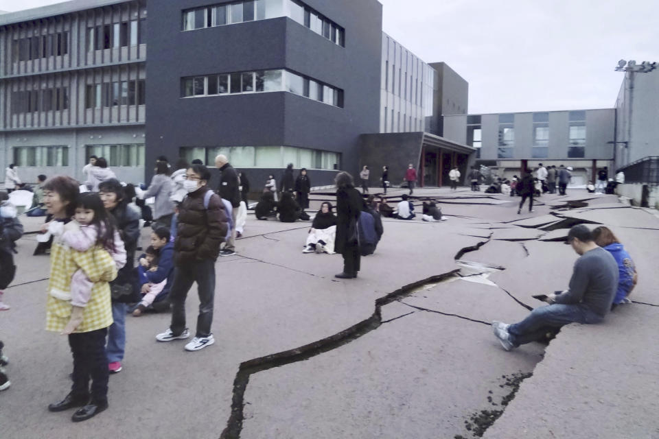 Cracks are seen on the ground in Wajima, Ishikawa prefecture, Japan Monday, Jan. 1, 2024, following an earthquake. Japan issued tsunami alerts Monday after a series of strong quakes in the Sea of Japan. (Kyodo News via AP)