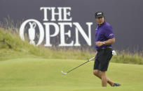 FILE - In this July 16, 2019, file photo, Phil Mickelson walks on the 18th green during a practice round ahead of the start of the British Open golf championships at Royal Portrush in Northern Ireland. Mickelson has decided to play the Saudi International next year, missing the Phoenix Open for the first time in 29 years. (AP Photo/Peter Morrison, File)