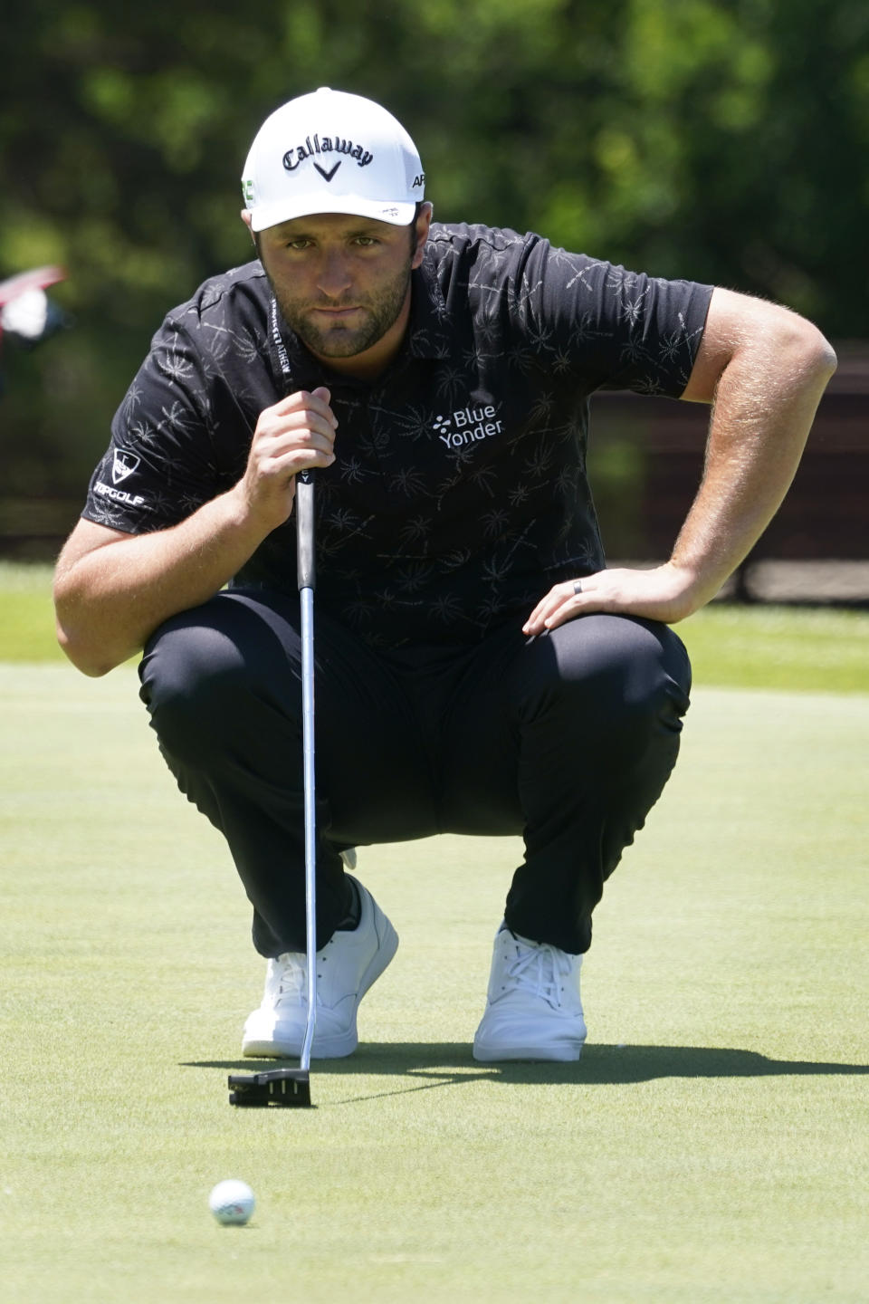 Jon Rahm, of Spain, lines up his putt on the first green during the first round of the AT&T Byron Nelson golf tournament, Thursday, May 13, 2021, in McKinney, Texas. (AP Photo/Tony Gutierrez)