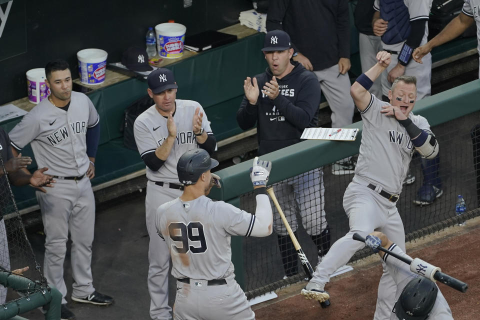 New York Yankees' Aaron Judge (99) celebrates his solo home run off Baltimore Orioles starting pitcher Spenser Watkins with teammates including Josh Donaldson, right, during the third inning of a baseball game, Tuesday, May 17, 2022, in Baltimore. (AP Photo/Julio Cortez)