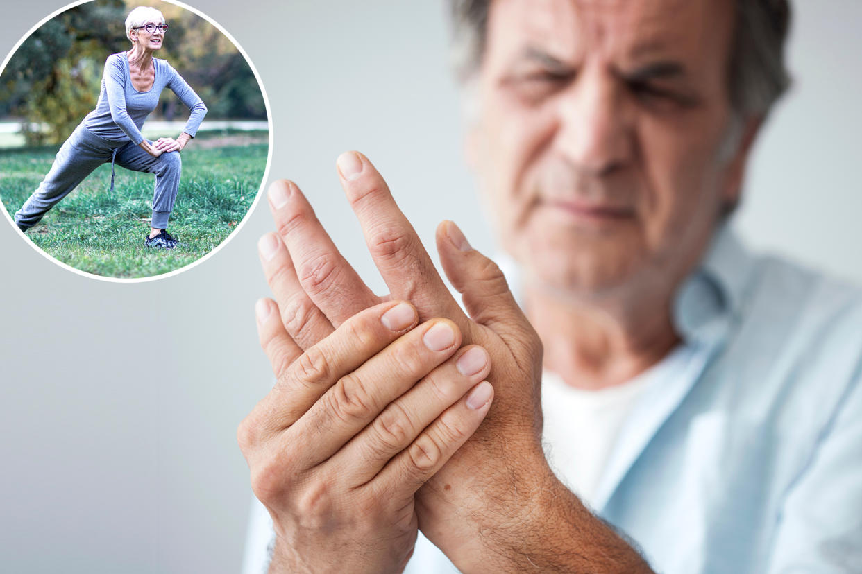 Old man holding his hands due to finger pain