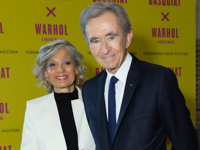 <p>Luc Castel/Getty </p> Helene Mercier and Bernard Arnault attend the "Basquiat x Warhol. Painting Four Hands" opening at the Louis Vuitton Foundation on April 3, 2023.