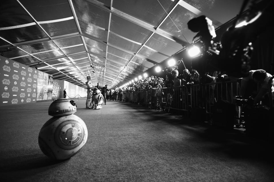 BB-8 prepares to roll down the carpet behind fellow droids C-3PO and R2-D2. (Photo: Charley Gallay/Getty Images for for Disney)