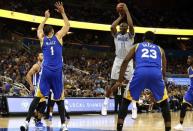 Jan 22, 2017; Orlando, FL, USA; Orlando Magic center Bismack Biyombo (11) shoots over Golden State Warriors center JaVale McGee (1) during the second half at Amway Center. Golden State Warriors defeated the Orlando Magic 118-98. Mandatory Credit: Kim Klement-USA TODAY Sports