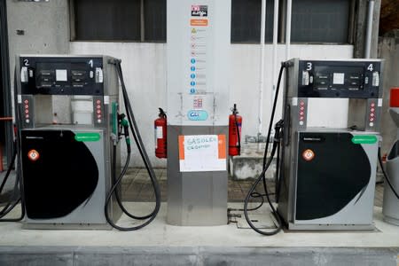 FILE PHOTO: A placard reading "Diesel sold out" is seen at a gas station in Porto