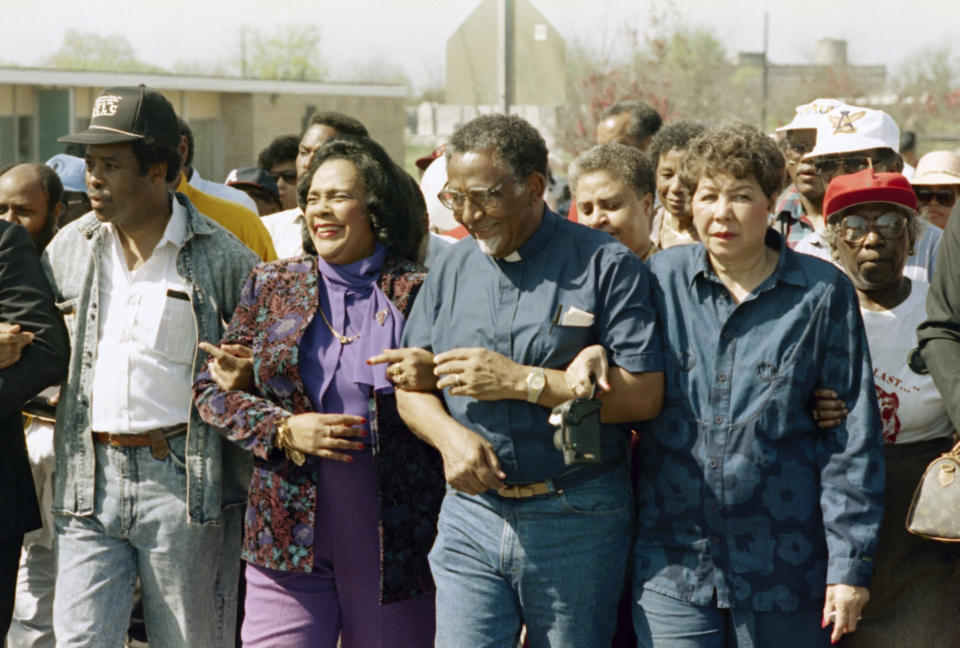 FILE - In this March 4, 1990, file photo, Coretta Scott King walks arm-in-arm with Southern Christian Leadership Conference President Joseph Lowery, second from right, in Selma, Ala., as marchers begin the final leg of their trek to the Alabama Capitol. The March 7, 2021, Selma Bridge Crossing Jubilee will be the first without the towering presence of John Lewis, as well as Lowery, the Rev. C.T. Vivian and attorney Bruce Boynton, who all died in 2020. (AP Photo/Dave Martin, File)