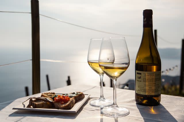 <p>Uta Theile</p> Local wine on the terrace of Cantina Capellini, in Volastra.