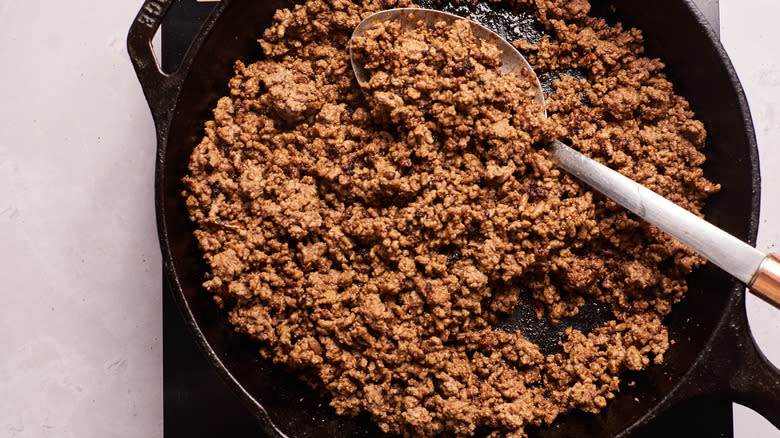 Ground beef cooking in pan