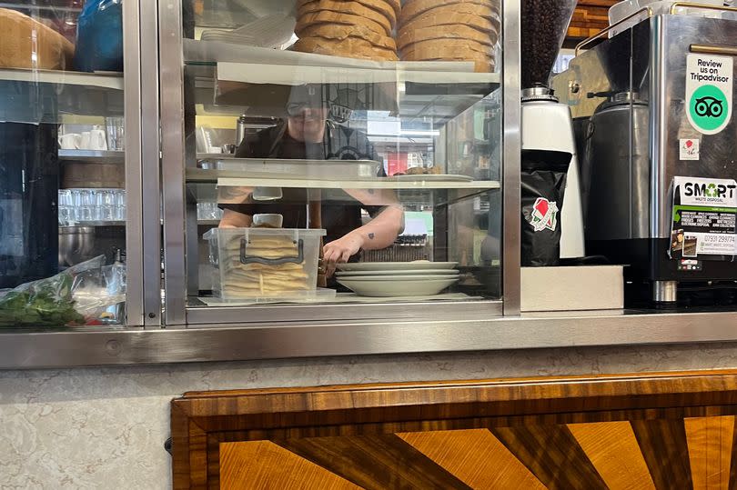 The glass and metal counter inside E. Pellicci