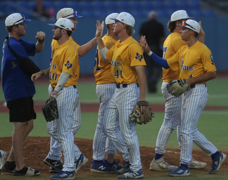 The Angelo State University Rams celebrate after defending their Lone Star Conference Baseball Tournament title against West Texas A&M at Foster Field at 1st Community Credit Union Stadium on Saturday, May 14, 2022.