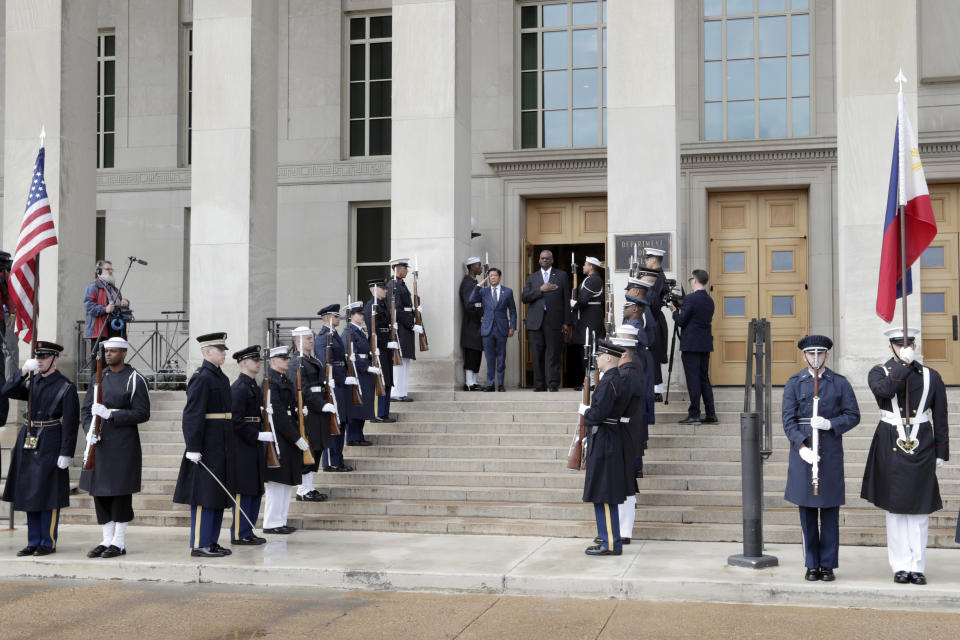 Secretary of Defense Lloyd Austin, center right, and Philippines President Ferdinand Marcos Jr., center left, stand during the American national anthem at an enhanced honor cordon ceremony at the Pentagon, Friday, April 12, 2024.(AP Photo/Luis M. Alvarez)