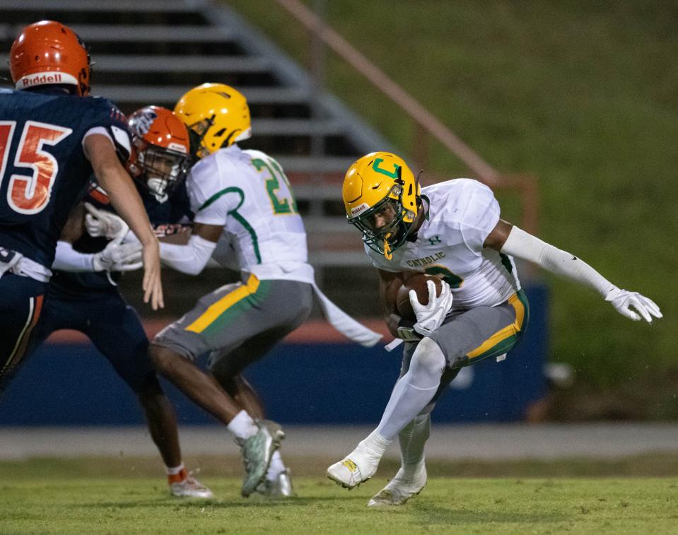 Justin Weatherall (9) returns a punt during the Pensacola Catholic vs Escambia football game at Escambia High School in Pensacola on Friday, Sept. 1, 2023.