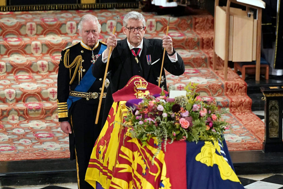 King Charles II, left, watches as The Lord Chamberlain Baron Parker breaks his Wand of Office, marking the end of his service to the sovereign, during a committal service for Britain's Queen Elizabeth II at St George's Chapel, Windsor Castle, in Windsor, England, Monday, Sept. 19, 2022.<span class="copyright">Joe Giddens—Pool/AP</span>