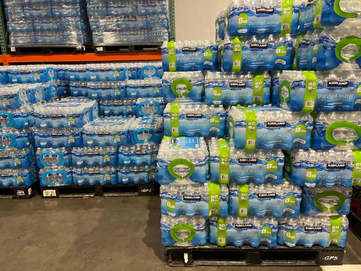 cases of water stacked in a costco