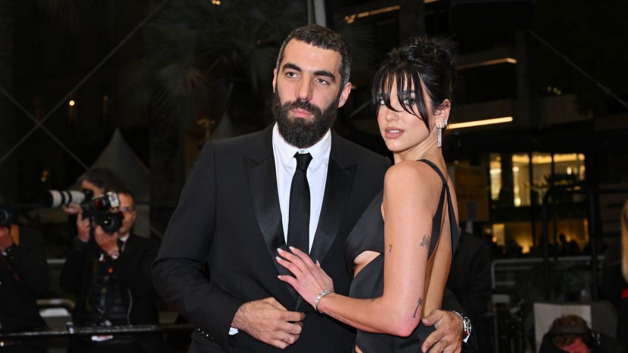 cannes, france may 19 dua lipa and romain gavras attend the omar la fraise the king of algiers red carpet during the 76th annual cannes film festival at palais des festivals on may 19, 2023 in cannes, france photo by stephane cardinale corbiscorbis via getty images