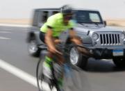 Egyptian cyclist Helmy El Saeed, 27, rides his bicycle during training on the highway of El Ain El Sokhna, east of Cairo, Egypt July 19, 2017. El Saeed has become a Guinness record holder after partaking in the fastest ever Europe bicycle cross. Picture taken July 19, 2017. REUTERS/Amr Abdallah Dalsh