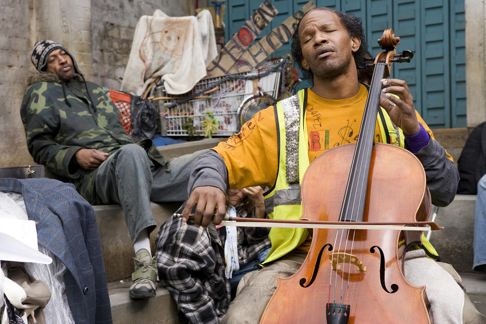 Ayers plays the cello for a fellow person experiencing homelessness