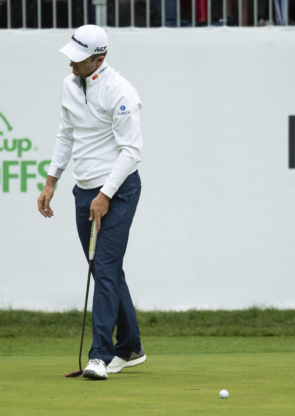Justin Rose, of England, reacts to missing a putt for par in the playoff hole during the BMW Championship golf tournament at the Aronimink Golf Club, Monday, Sept. 10, 2018, in Newtown Square, Pa. Keegan Bradley held off Justin Rose in a sudden-death playoff to win the rain-plagued BMW Championship for his first PGA Tour victory in six years. (AP Photo/Chris Szagola)