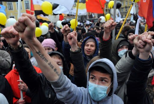 Russians raise their fists during a rally in December 2011 in central Saint Petersburg against what they say were rigged parliamentary polls. Russia's president-elect Vladimir Putin has broken his last link with the ruling but increasingly unpopular party he formed a decade ago by handing its reins to his future premier Dmitry Medvedev