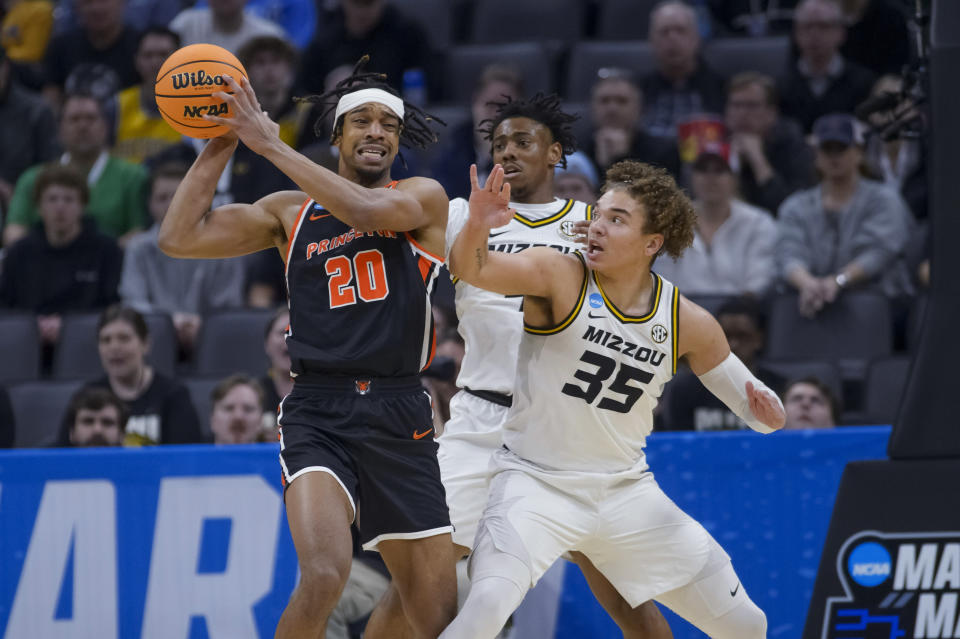 Princeton forward Tosan Evbuomwan (20) is guarded by Missouri forward Noah Carter (35) during the first half of a second-round college basketball game in the men's NCAA Tournament in Sacramento, Calif., Saturday, March 18, 2023. (AP Photo/Randall Benton)