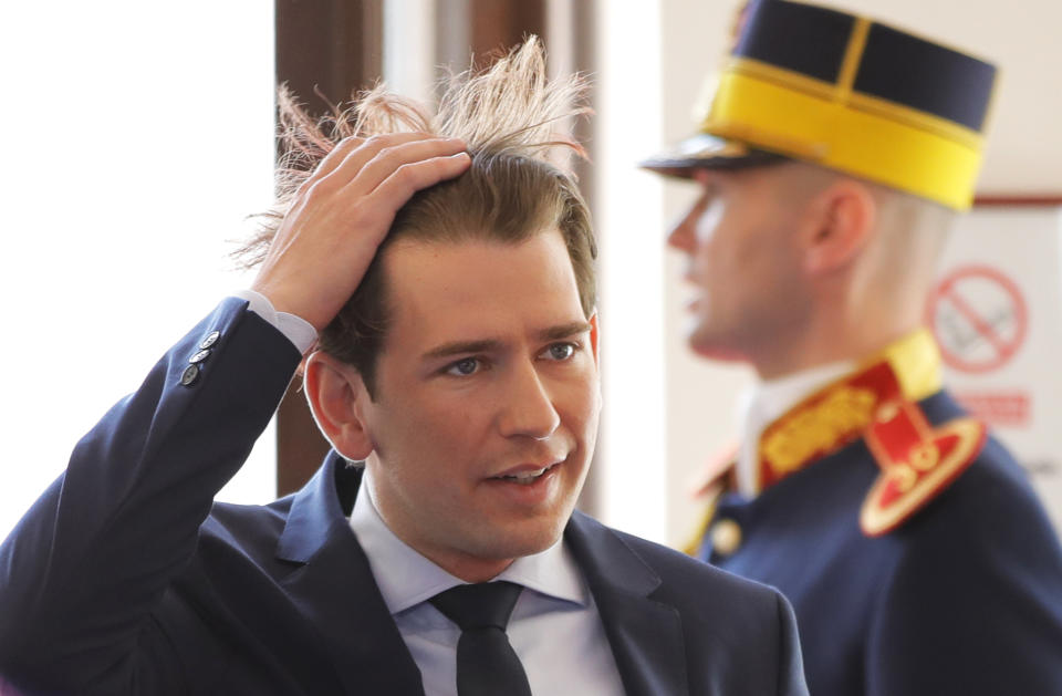 Austrian Chancellor Sebastian Kurz, left, fixes his hair as he arrives for an EU summit in Sibiu, Romania, Thursday, May 9, 2019. European Union leaders on Thursday start to set out a course for increased political cooperation in the wake of the impending departure of the United Kingdom from the bloc. (AP Photo/Vadim Ghirda)