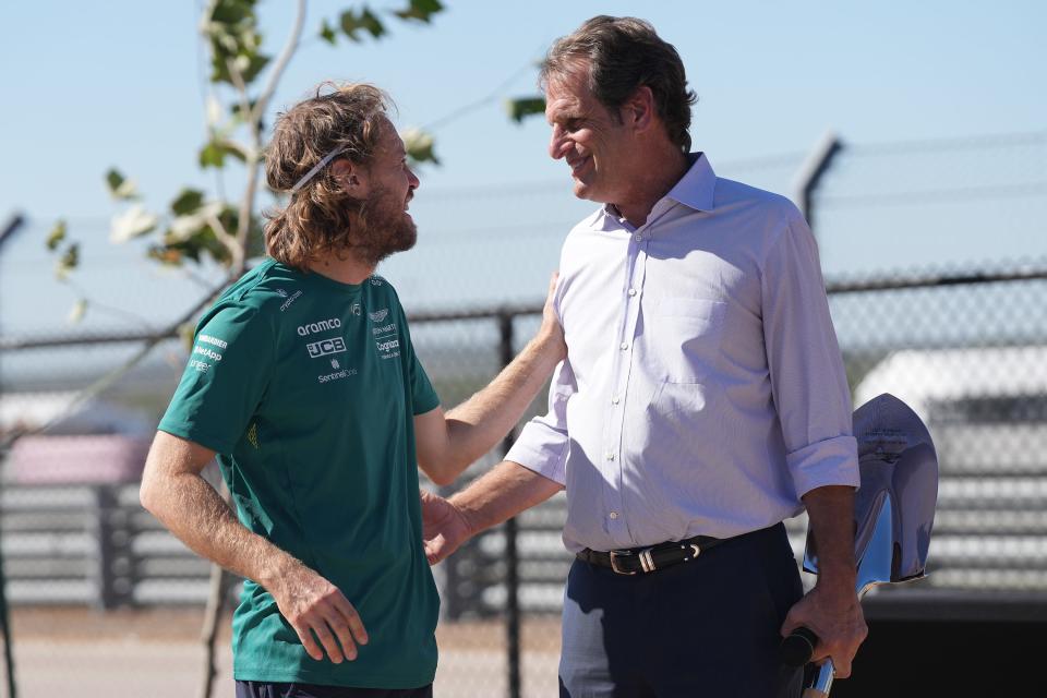 Aston Martin driver Sebastian Vettel. left, meets Circuit of the Americas chairman Bobby Epstein during a sapling distribution ceremony at Circuit of the Americas on Thursday. COTA will plant 296 trees in honor of the total amount of F1 races Vettel will reach at this weekend’s United States Grand Prix.