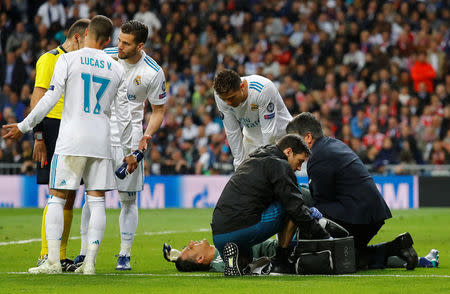 Soccer Football - Champions League Semi Final Second Leg - Real Madrid v Bayern Munich - Santiago Bernabeu, Madrid, Spain - May 1, 2018 Real Madrid's Keylor Navas receives medical attention REUTERS/Kai Pfaffenbach