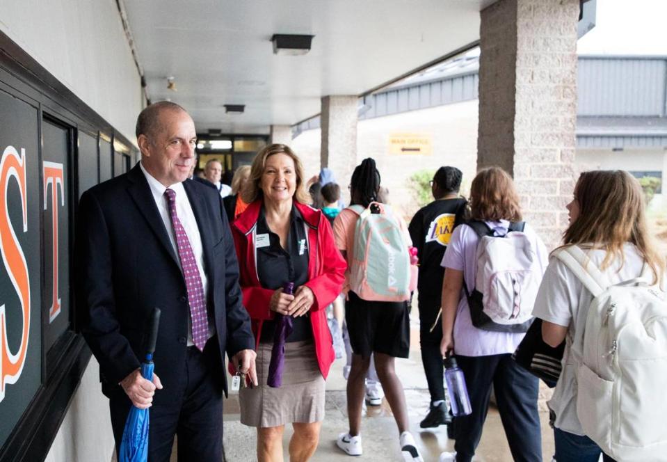 Cabarrus County Schools Superintendent Dr. John Kopicki, left, and Cabarrus County Schools Board Chair, Denise Alcock walks out of Northwest Cabarrus STEM Middle School as students change classes on the first day of school on the first day of school.