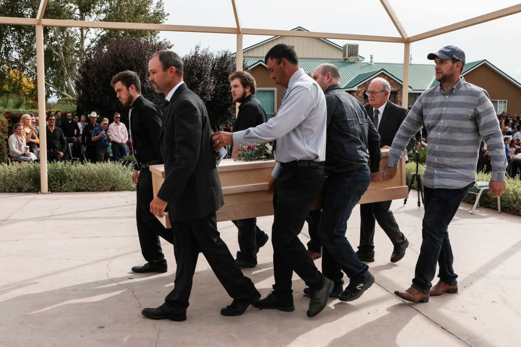 <p>Relatives carry a coffin during the funeral service of Dawna Ray Langford, 43, and her sons Trevor and Rogan, who were among nine victims killed in the attack</p> (AFP via Getty Images)