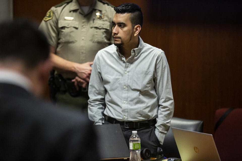 Cristhian Bahena Rivera stands as the jury leaves the room for a break during his trial, on Monday, May 24, 2021, in the Scott County Courthouse, in Davenport, Iowa. Bahena Rivera is on trial after being charged with first degree murder in the death of Mollie Tibbetts in July 2018. (Kelsey Kremer/The Des Moines Register via AP, Pool)