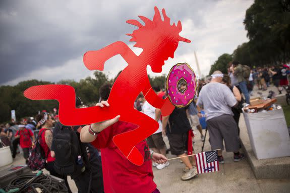 Mandatory Credit: Photo by SHAWN THEW/EPA-EFE/REX/Shutterstock (9064853j) A Juggalo, fan of the band Insane Clown Posse, carries a Hatchetman with a doughnut during the Juggalo March at the Lincoln Memorial in Washington, DC, USA, 16 September 2017. The march is in protest to the FBI's National Gang Intelligence Center listing the Juggalos as a 'hybrid gang.' Juggalo March on the National Mall, Washington, USA - 16 Sep 2017