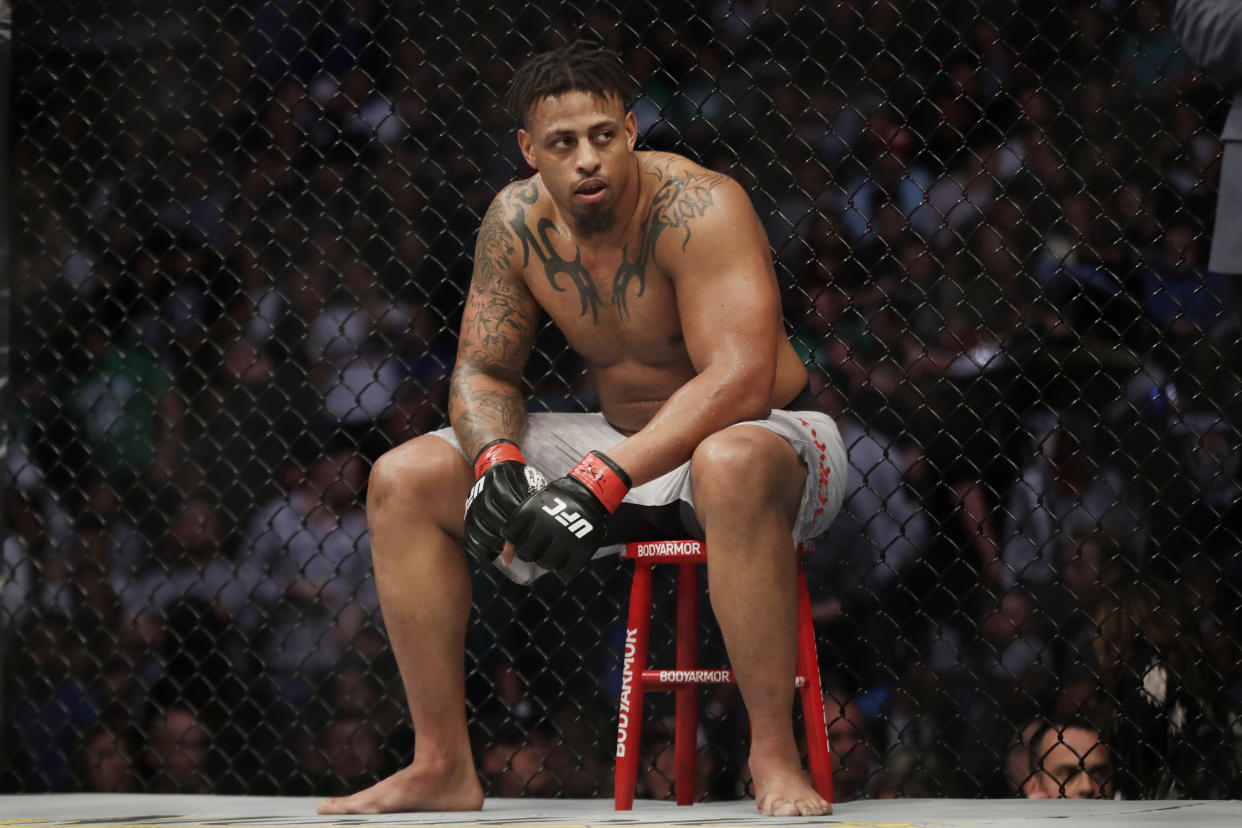 Greg Hardy sits during a break in a heavyweight mixed martial arts bout against Ben Sosoli, Friday, Oct. 18, 2019, at UFC Fight Night in Boston. (AP Photo/Elise Amendola)