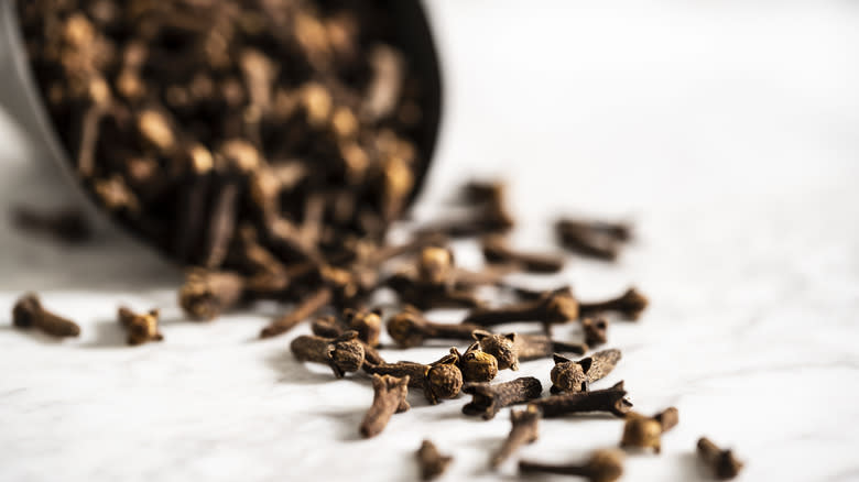 Cloves scattered from bowl