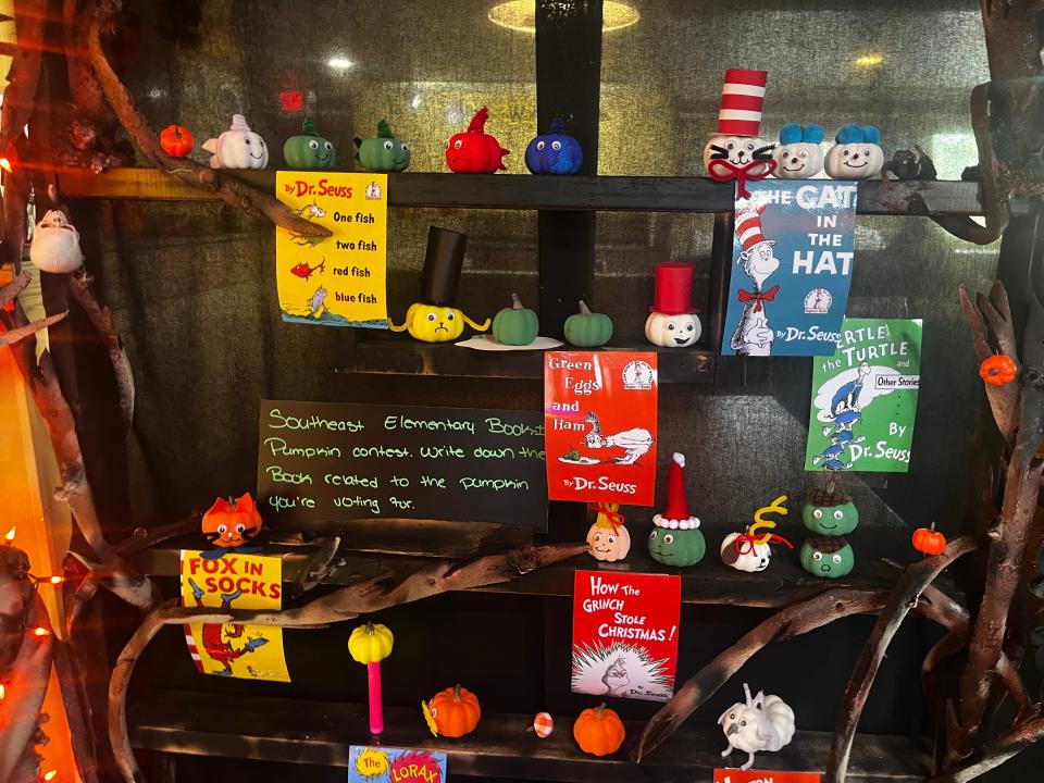 Decorated pumpkins from the three first grade classes are displayed inside the Pizza Hut at 732 E Cumberland St.